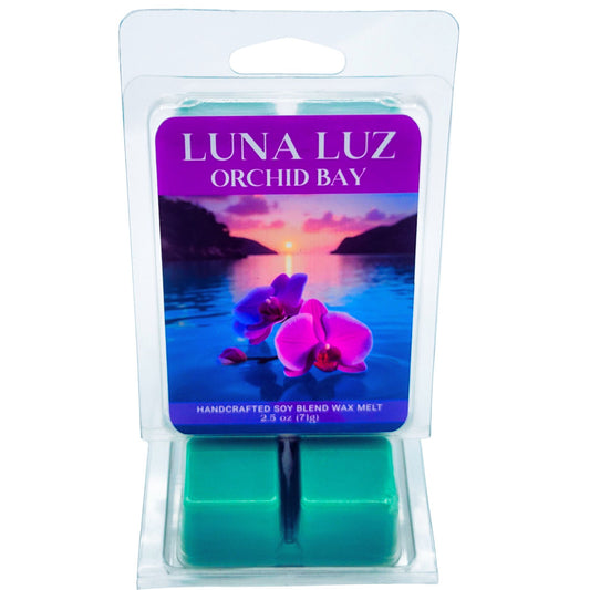 Luna Luz Orchid Bay wax melt packaging showing a beautiful lagoon with two colorful orchids floating on top of the water. Image set on a white background.